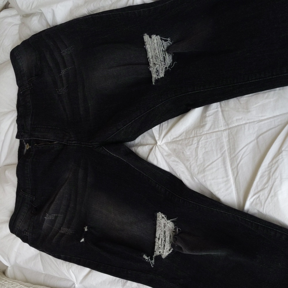 Woman's soft black shredded jeans